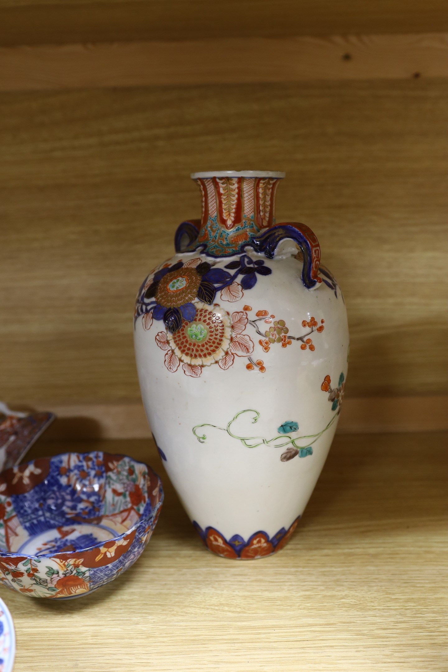 A Japanese Imari two handled vase, a Kangxi Imari bowl a/f and a collection of similar Japanese and continental ceramics